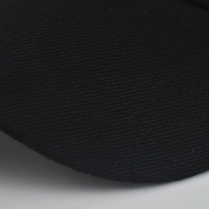 Detailed macro view of black twill fabric texture on the sun visor beach hat