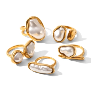 5-piece set of gold stainless steel rings with irregular baroque pearls on white background