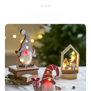 Close-up of wooden Christmas gnome with LED glowing nose and warm winter scene lighting