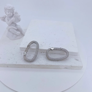 Macro shot of silver micro-paved oval crystal clasps for DIY jewelry making