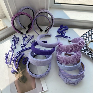Detail of assorted purple resin butterfly hair claws and fabric headbands set