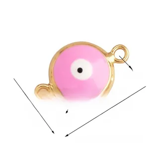 Detailed view of pink enamel Evil Eye jewelry link with measurements 10mm x 16mm