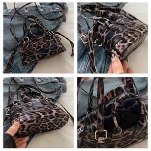 Detail view of leopard print PU handbag with drawstring closure and crossbody strap