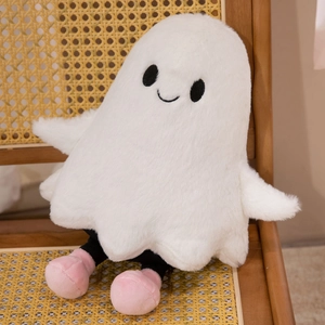 Close-up of cute plush ghost doll with soft white fur and pink feet on a wooden chair