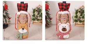Detail of burlap Christmas wine bottle covers featuring reindeer and bear designs