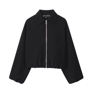 Women's black cropped puff jacket featuring a stylish lapel and silver metal zipper closure