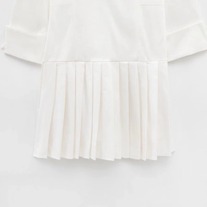 White short sleeve lapel romper dress featuring pleated hem and woven texture design