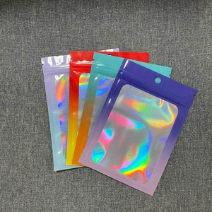 Detailed view of colorful laser holographic resealable plastic bags with clear windows