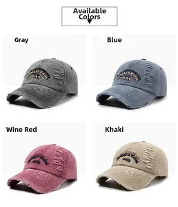 Detail of vintage distressed baseball caps with 3D letter embroidery and frayed edges