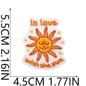 Detail shot of yellow sun embroidery patch with In love with the sun text and dimensions