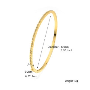 Detail view of a 5.9cm gold-plated bangle with micro-pave zircons and side clasp