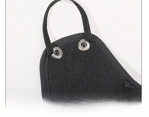 Close-up of winter thermal hat showing the snap button closure and mask attachment detail