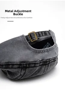 Detail of adjustable metal buckle on grey washed denim ivy cap with fine stitching