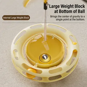 Yellow tumbler cat toy with food dispenser track balls and feather teaser on spring
