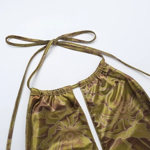 Detailed close-up of floral print satin halter dress showing neckline and drawstring