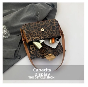 Detailed top view of leopard print crossbody bag showing spacious interior for daily items