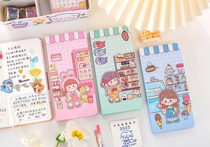 Detailed view of three cute Japanese style weeks planner notebooks with colorful covers