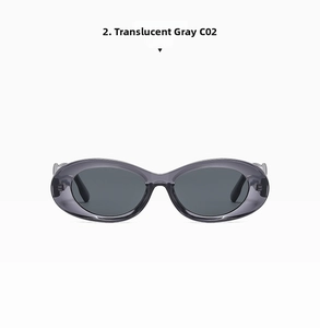 Detail of retro oval sunglasses with translucent grey frames and dark lenses