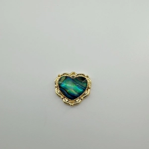 Detail of 18K gold-plated heart pendant with natural green shell inlay for DIY jewelry