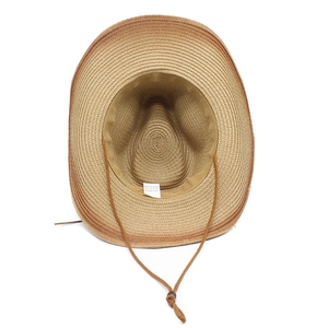 Detail of western straw hat interior showing 100% paper material label and wind rope