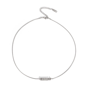 Detailed close-up of silver snake chain necklace with K18 engraved tag and clasp