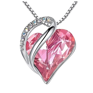 Silver heart-shaped necklace with pink crystal and sparkling rhinestones on white background