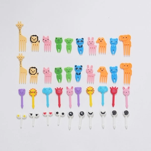 Colorful animal-shaped plastic fruit picks featuring giraffe, lion, and panda for kids