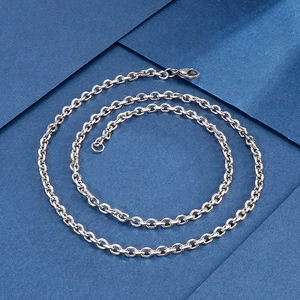 Polished silver stainless steel O-chain necklace with lobster clasp on blue background