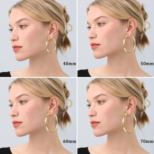 Gold plated hoop earrings for women shown in four sizes from 40mm to 70mm diameter
