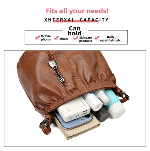 Interior view of the brown leather shoulder bag showing large capacity for daily essentials