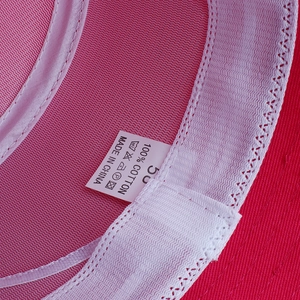 Main interior view of pink cotton sun hat featuring breathable mesh lining and size label