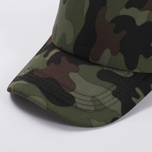 Detail of woodland camouflage baseball cap featuring four rows of stitching on the brim