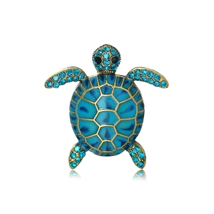 Exquisite turtle brooch with blue enamel and rhinestones on a gold metal base