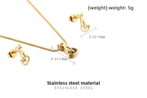 Detailed view of gold cat jewelry set with stainless steel necklace and stud earrings