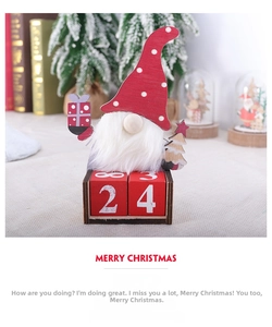 Close-up of wooden Christmas gnome advent calendar with countdown blocks on festive desk