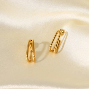 18k gold plated double hoop geometric earrings on premium champagne silk background