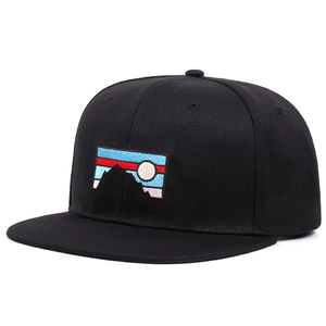 Black cotton baseball cap with colorful mountain and sunrise embroidery in flat lay view