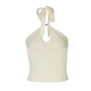 Detail of cream white halter neck top featuring delicate fabric and back tie design