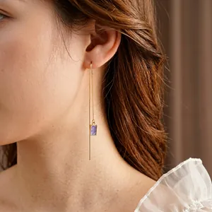 Elegant gold drop earrings with purple rectangular enamel pendants and long tassels