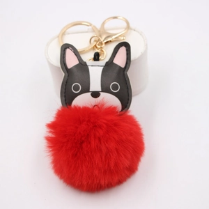 French bulldog leather charm with large red pom-pom and gold lobster clasp keychain