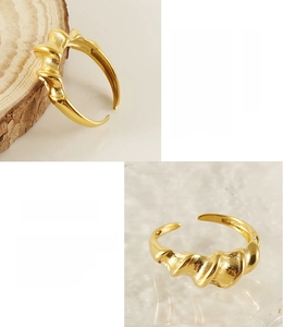 Detail of twisted 18K gold plated stainless steel ring with unique textured wrinkles