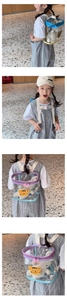 Detail view of transparent kids PVC backpack with colorful edges and plush bunny decor