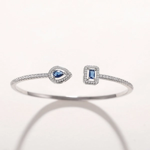 Adjustable silver copper bangle with pear and rectangular blue zircon stones