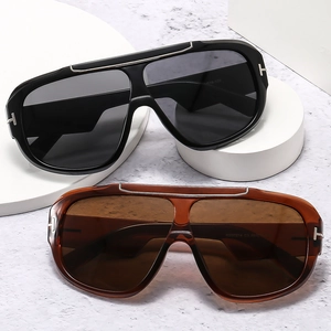 Oversized sport aviator sunglasses in black and brown with metal T-shaped hinge details