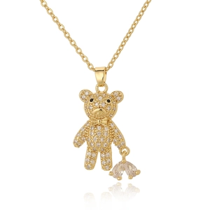 Gold bear pendant necklace encrusted with clear rhinestones on white background