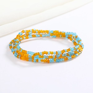 Detail of colorful layered glass seed bead body chain in blue and orange contrast