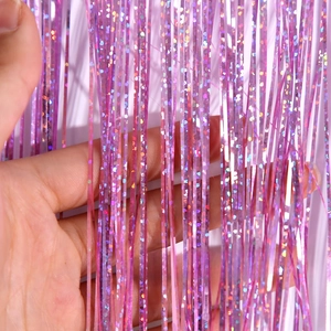 Detail showing 1mm wide laser purple tinsel fringe curtain for party background decoration