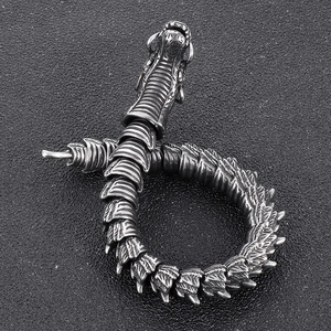 Detailed view of punk dragon bracelet showing vintage silver steel texture and articulated joints