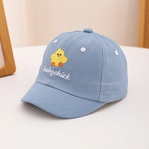 Detail of baby light blue cotton cap featuring yellow chick and babychick embroidery