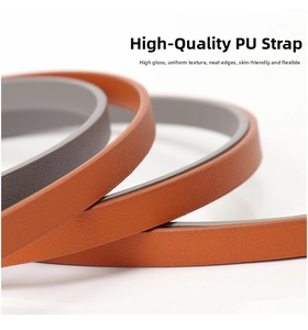 Detail of soft PU leather belts in brown and taupe with smooth oil-edge finish